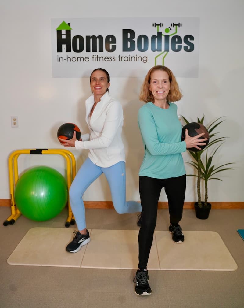 Trainers performing a rotational lunge for functional fitness. trainers performing rotational lunge for fun fitness