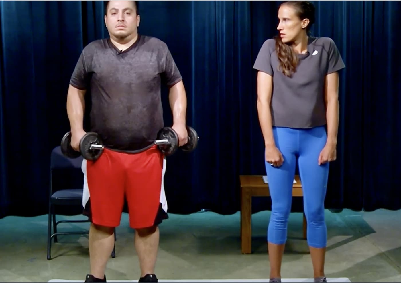 man performing shrugs