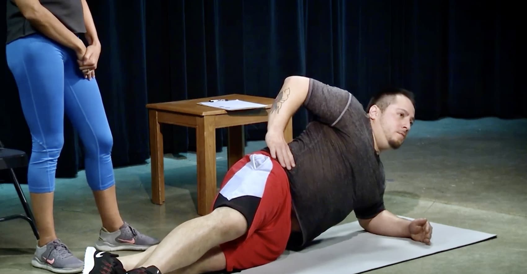 Here you'll see a man learning how to do a side plank with Home Bodies. man doing side plank